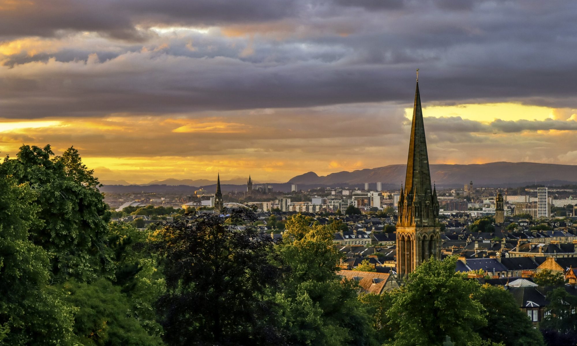 A sunset view of Glasgow from Queen's Park
