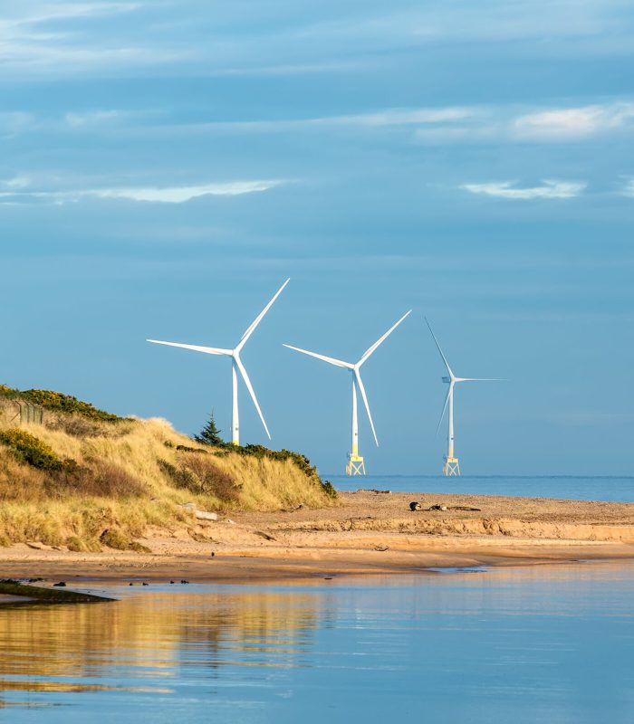 Offshore wind turbine farm, offshore supply vessel and Don River Delta on Scotland coast of Aberdeen, UK